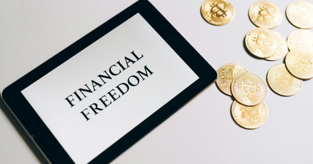 a tablet with the text “financial freedom”, representing financial goals to make money.