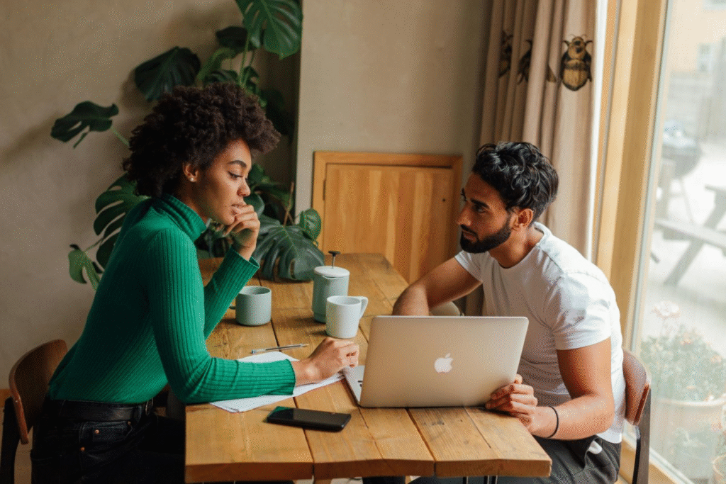 A man and woman brainstorming on how to split finances in marriage and plan their financial future.