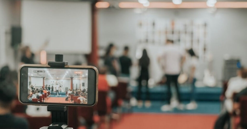 A picture showing a person who makes money on TikTok recording an event