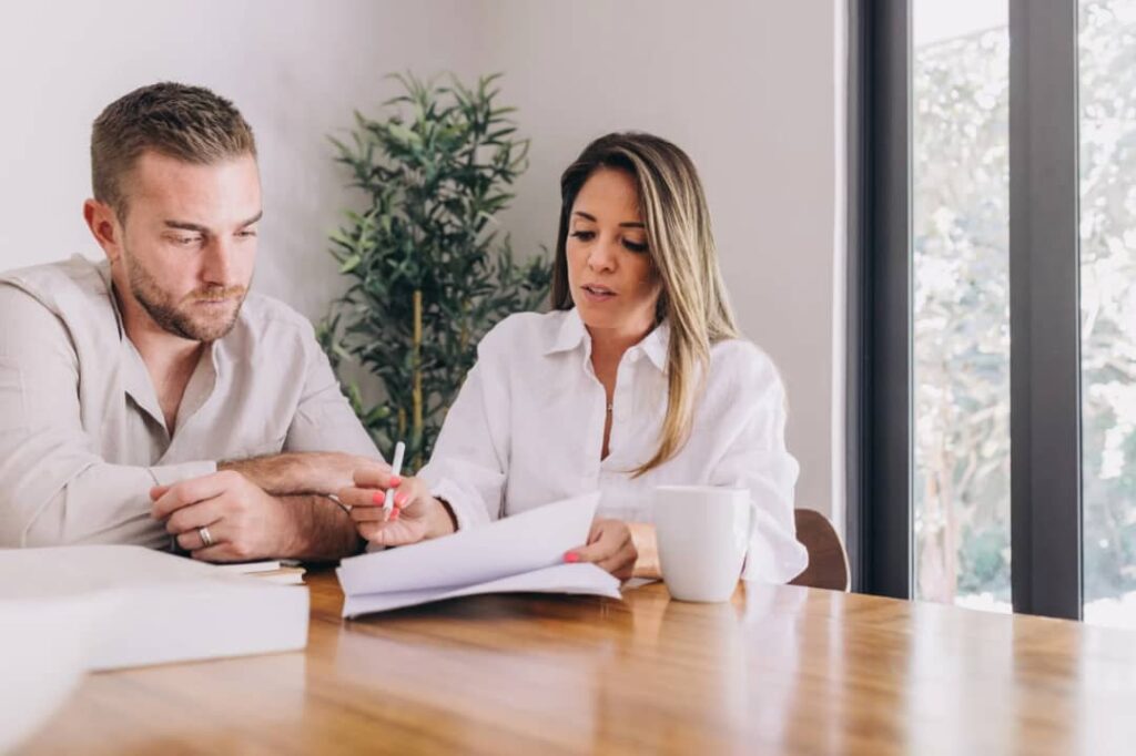 An image showing a man and a woman managing money as a couple.
Managing money as a couple can feel exhausting, especially when you both have your own habits, goals, and maybe even your own little secrets about spending.