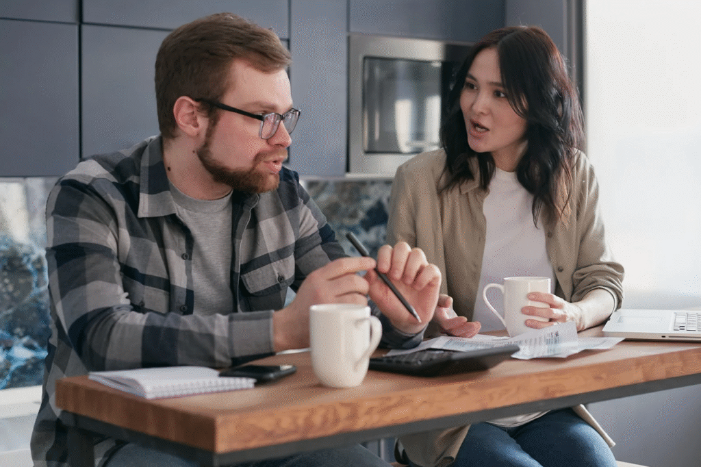 An image showing a couple trying to create a financial plan to reduce financial imbalance
