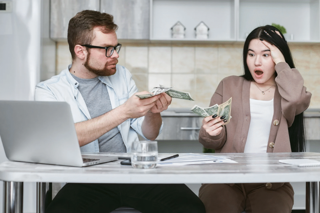 A picture showing Two couples with money are frustrated by common money mistakes that strain marriages