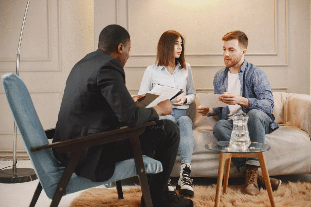 A picture showing Two couples talking to a counsellor after discovering financial infidelity, one of the common money mistakes that strains marriages
