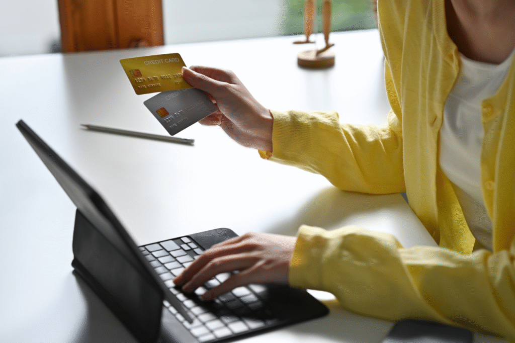 An image showing a lady with different credit cards handling finances to avoid common money mistakes that strain marriages