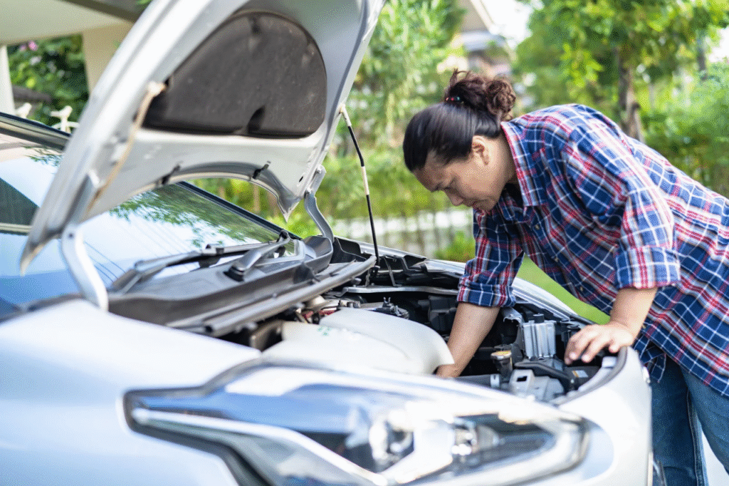 An image showing a man who experienced a car breakdown.