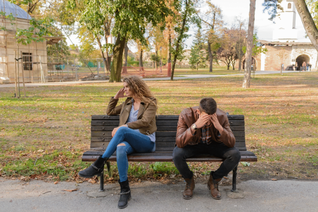 An image showing couples sitting on a bench