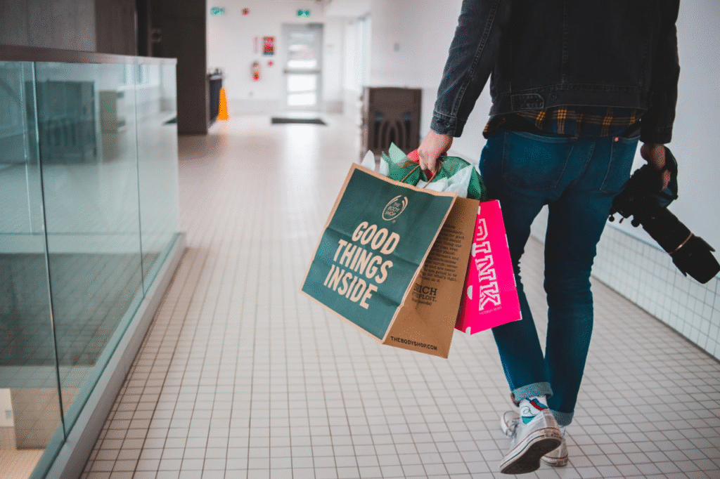 An image showing a guy with a shopping bag