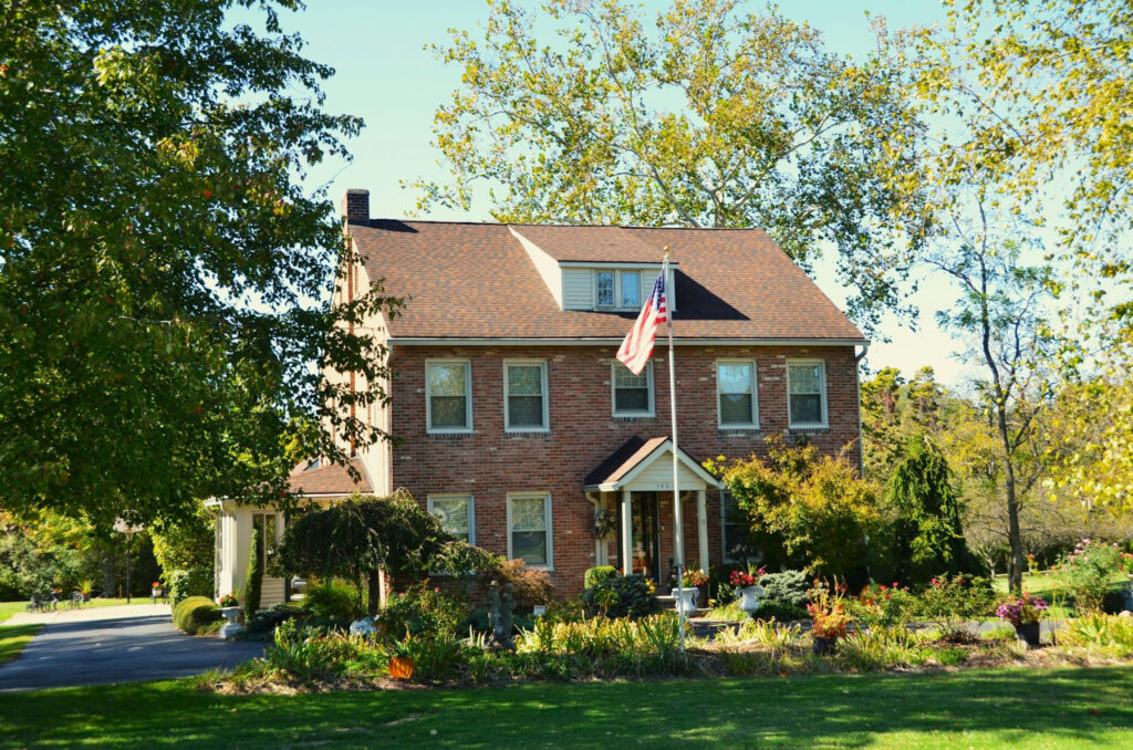 An image showing a suburban family home representing long-term stability, homeownership, and the financial goals couples work toward before marriage