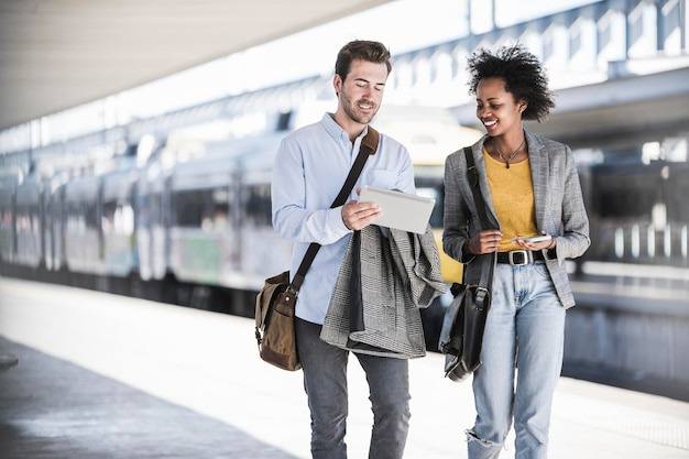 An image showing Supportive couple walking together during a spouse’s career transition and figuring out how to survive a career change as a couple.